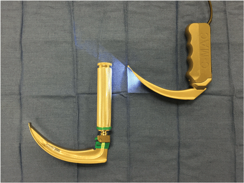 Image 1. On the left is a traditional Macintosh laryngoscope, with standard geometry. To the right is a video laryngoscope device which also maintains the standard curvature.