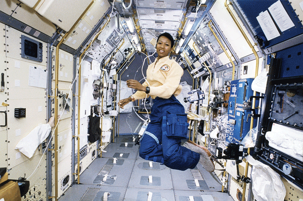 Mae Jemison, MD, (a general practitioner) floats in zero gravity at the Spacelab Japan Science module aboard STS-105, Endeavour.